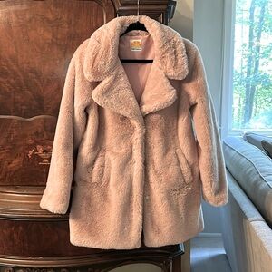 A very fuzzy puffy warm stylish pink jacket.